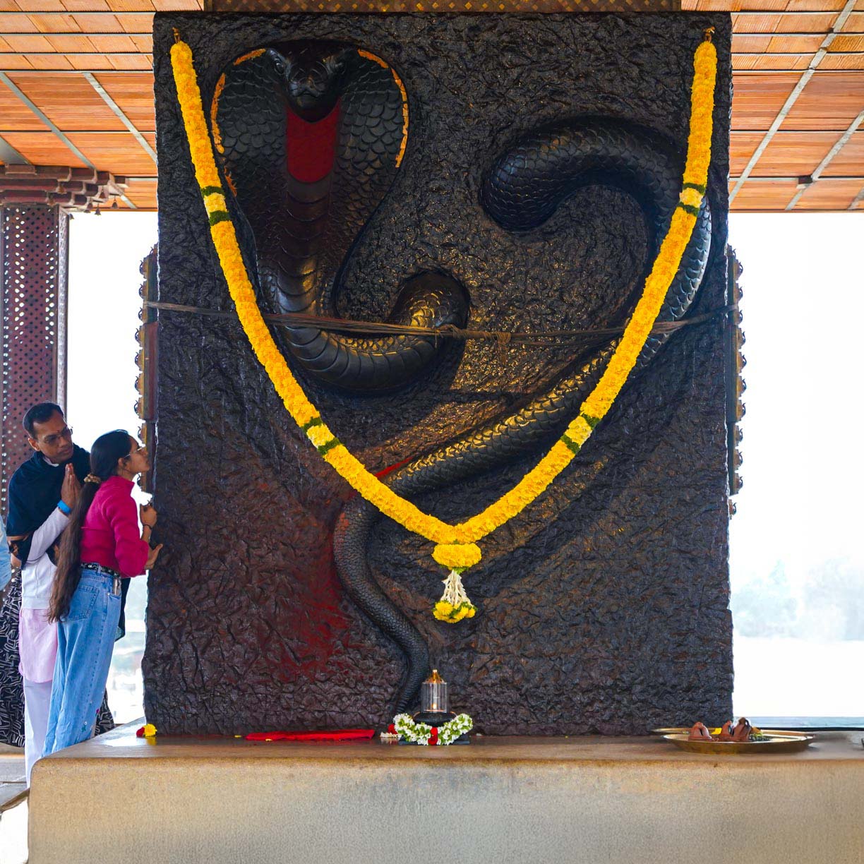 Begin with a pooja at the sacred Naga Temple, symbolizing purification and preservation.